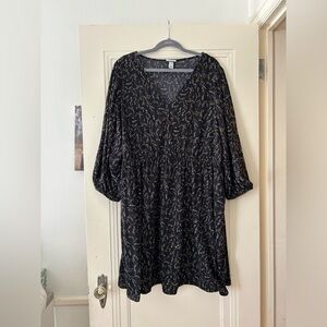 Black dress with pockets and floral design